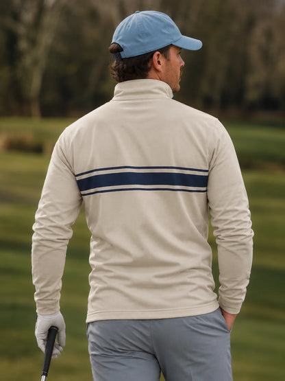 Golfpullover mit Viertelreißverschluss und marineblauem Bruststreifen auf elfenbeinfarbenem Grund, aus Funktionsmaterial