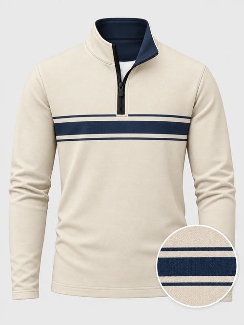 Golfpullover mit Viertelreißverschluss und marineblauem Bruststreifen auf elfenbeinfarbenem Grund, aus Funktionsmaterial