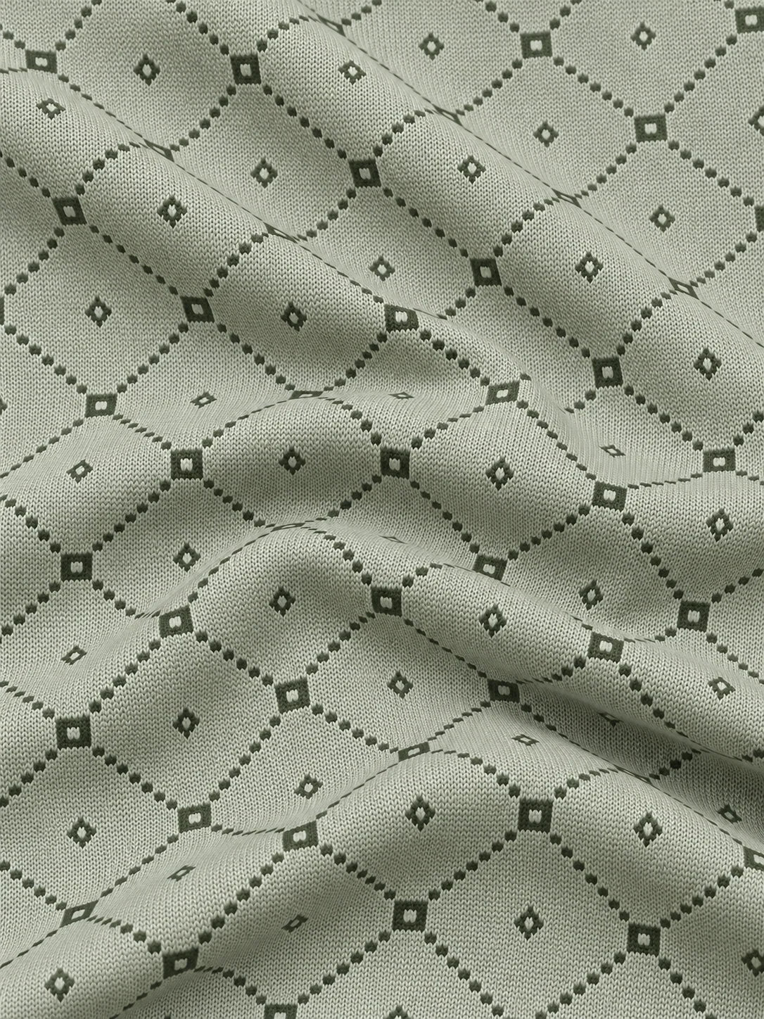 Salbeigrüner Golfpullover aus Funktionsmaterial mit geometrischem Muster und kurzem Reißverschluss