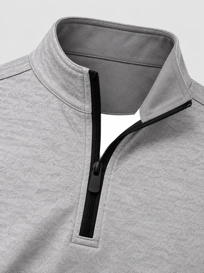 Hellgrauer Golfpullover aus Funktionsmaterial mit strukturierter Oberfläche und kurzem Reißverschluss
