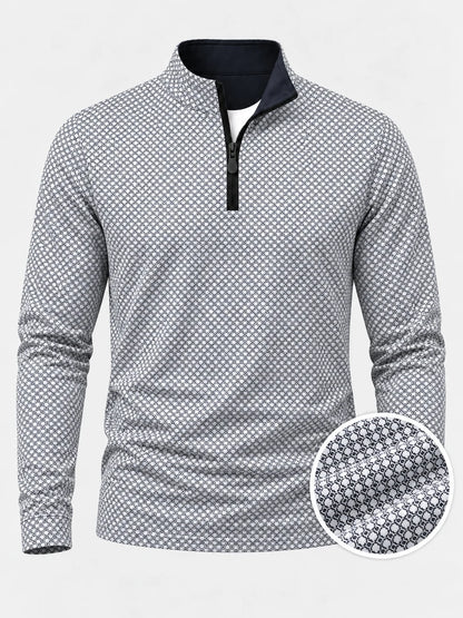 Performance-Golfpullover mit schwarz-weißem geometrischem Muster und Viertelreißverschluss